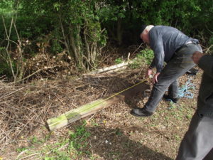 James measuring original SR fence post, to check spacing of timber rails