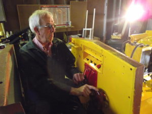 Bob tries the seat and the controls. New electrical control panel evident