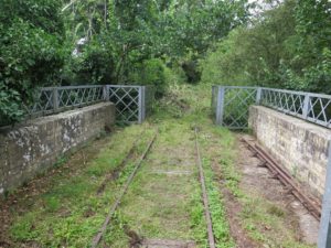 Northermost (practical) bridge - before strimming. SR track panel in centre, pointwork parts to sides. Steel fencing is not original, but looks very good and railway-like