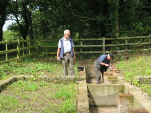 Ash pit - James preparing for the repair bricklaying (which was admirably done by Robin). John R (I told you there are lots of Johns) checking it out