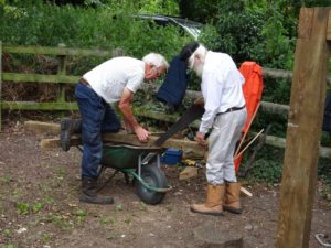 Sawing the sleepers for the pump platform - wheelbarrow a temporary workbench