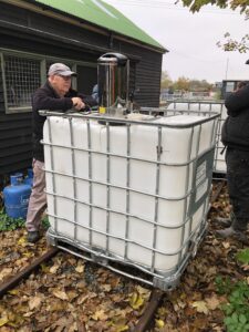 Tea Urn being put to work on the locomotive water containers