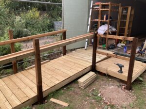 wooden ramp up to container door